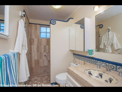 11---Guest-Bath-has-Polished-Marble-Surfaces-and-Tile-with-Mexican-Handpainted-Tiles