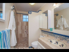 11---Guest-Bath-has-Polished-Marble-Surfaces-and-Tile-with-Mexican-Handpainted-Tiles