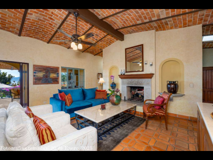02---Living-Room-with-Soaring-Brick-Ceilings,-Art-Niches-and-Double-Hearth-Fireplace