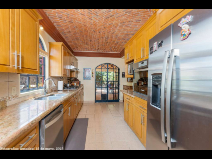03 - Spacious Kitchen with Brick Domed Ceiling Leads Out to Grilling Kitchen and Garden Terrace
