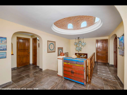 10 - Foyer is Crowned with a Grand Cupola Dome and Parota Wood Banister