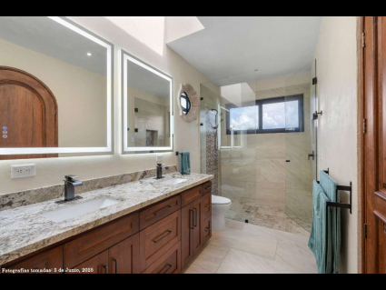 07---South-Master-Bath-with-Lake-View,-Twin-Vanity-and-Skylight