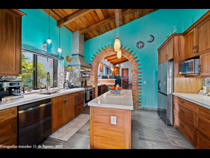 03 - Renovated Kitchen with Cathedral Ceiling flows from the Dining Room and Wine Bar
