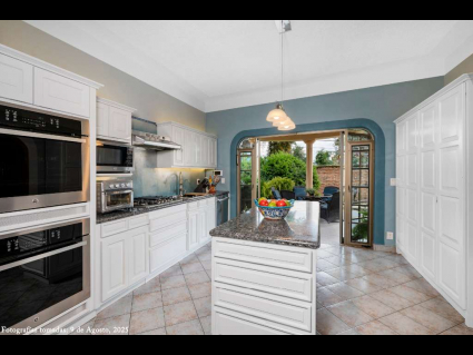14 - Elegant Modern Kitchen Leads out to the South Garden Porch