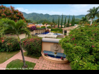 11---Lush-Gardens-connect-the-Main-House-to-the-Casita-Pool-House-and-the-Tropical-Mountain-Backdrop
