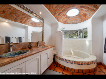 10--Main-House-Upper-Suite-Bath-with-Curved-Shower,-Double-Vanity-and-Brick-Domed-Ceiling