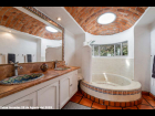 10--Main-House-Upper-Suite-Bath-with-Curved-Shower,-Double-Vanity-and-Brick-Domed-Ceiling