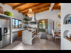 01---Penthouse-Kitchen-and-Dining-with-Wood-Ceilings-and-Lake-View