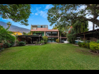 EL-CHANTE-ENCANTO-LAKE-FRONT-01-YARD-HOUSE