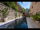 12---Pool-Terrace-is-viewed-by-both-Second-Floor-Bedrooms,-Living,-Dining-and-Kitchen