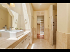 05---Master-Bathroom-with-Skylit-Vanity,-Walk-In-Shower-and-Closet