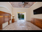 06---Master-Bedroom-with-Domed-Ceiling,-Crown-Molding-and-Private-Pool-Slider