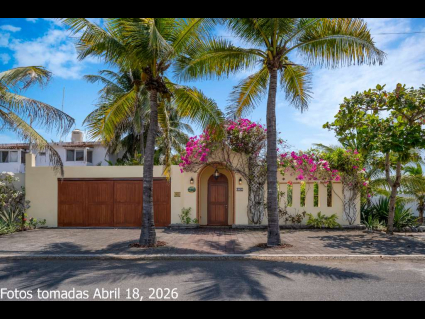 04---Charming-Street-Facade-with-Double-Garage,-Tropical-Palms-and-Fuisha-Bugambillia