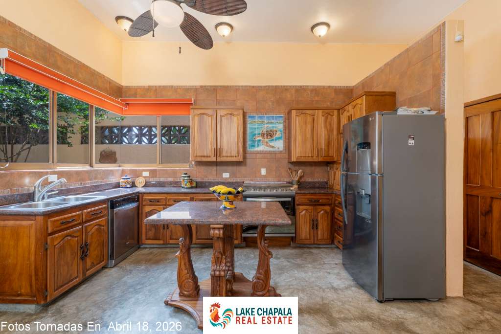 09 - Kitchen with Tropical Parotta Wood Cabinets and Ocean View