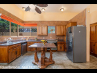 09---Kitchen-with-Tropical-Parotta-Wood-Cabinets-and-Ocean-View