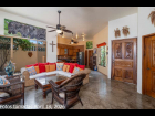 11---Open-Concept-Living-Room-Flows-to-Kitchen-and-Lanai