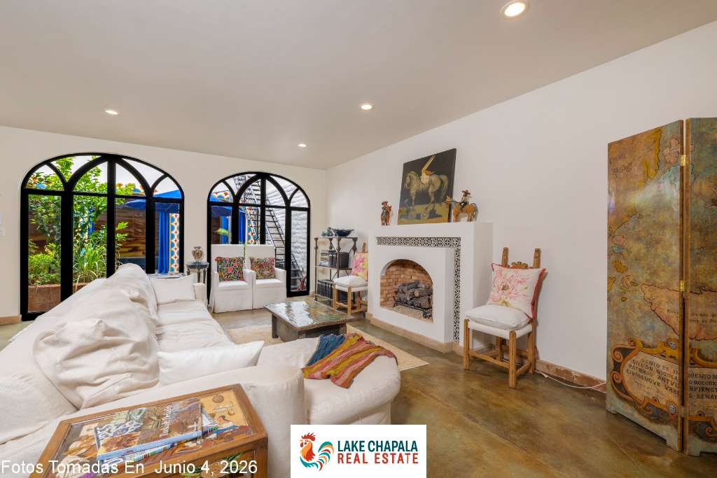 011 Den with Fireplace leading to Courtyard