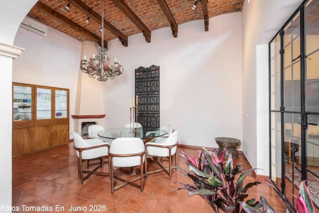 002 - Dining Room with Beamed Ceiling and Fireplace