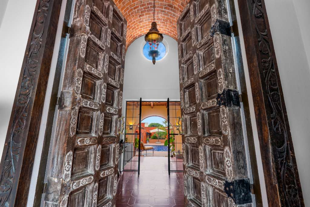 001 - Hand Carved 10 Foot High Entrance Doors
