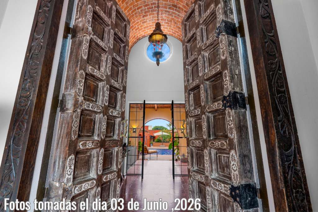 001 - Hand Carved 10 Foot High Entrance Doors