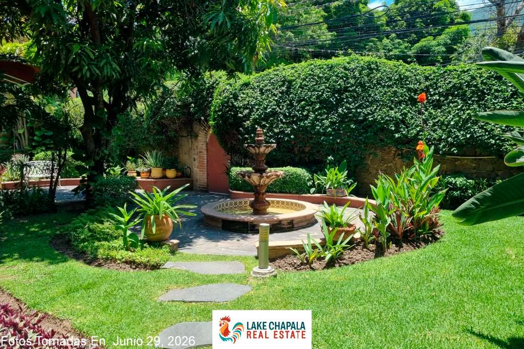 01- Lush Front Garden with Cantera Stone Fountain and Flagstone Terrace