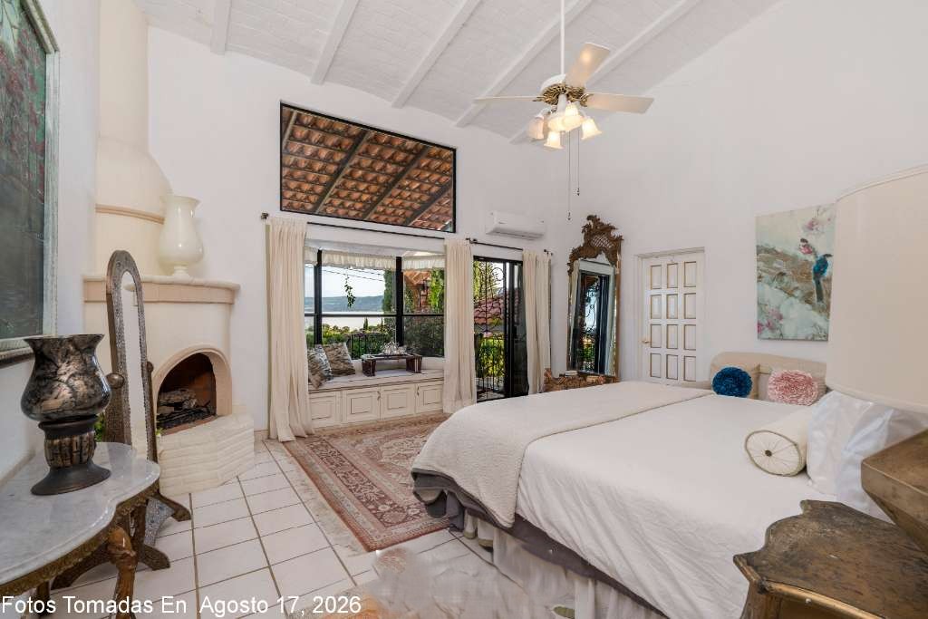 009 - Master Lake View Bedroom with Window Seat, Fireplace and Terrace Access Leading to Hot Tub Spa