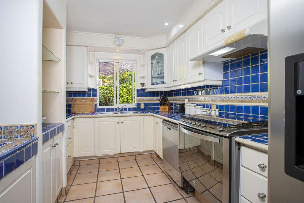 Smith 16 - Sunlit Blue and White Kitchen with Garden and Mountain View