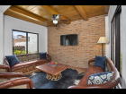 Casa Mali 07 - Exposed Brick and Wood Beams in Living Room