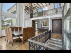 8. Dining room with double height vaulted ceiling 